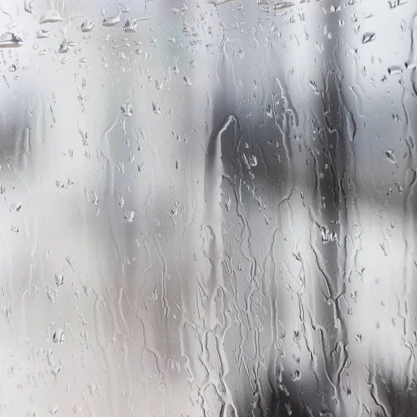 Pouring rain on very wet glass pane — Stock Photo, Image