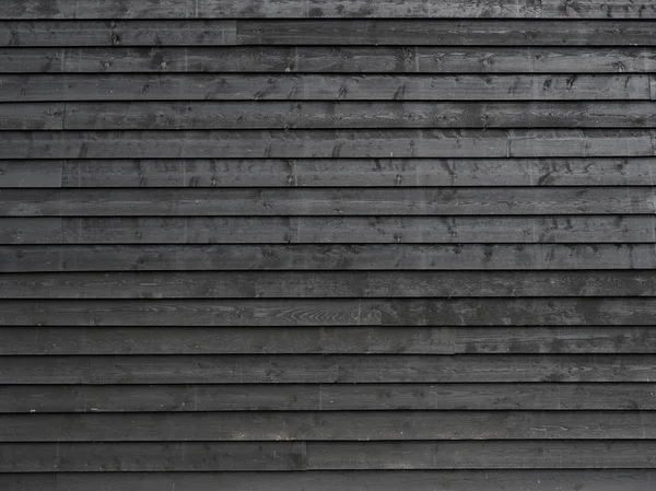 Part of black painted wooden planks of barn wall or shed — Stock Photo, Image