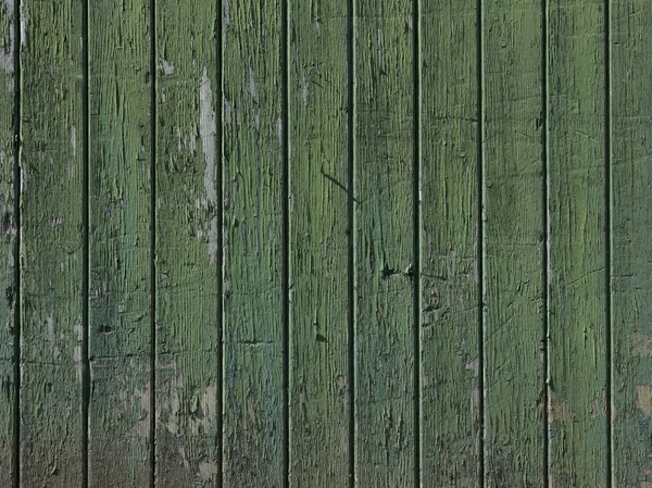 Part of old green painted barn door with vertical planks — Stock Photo, Image