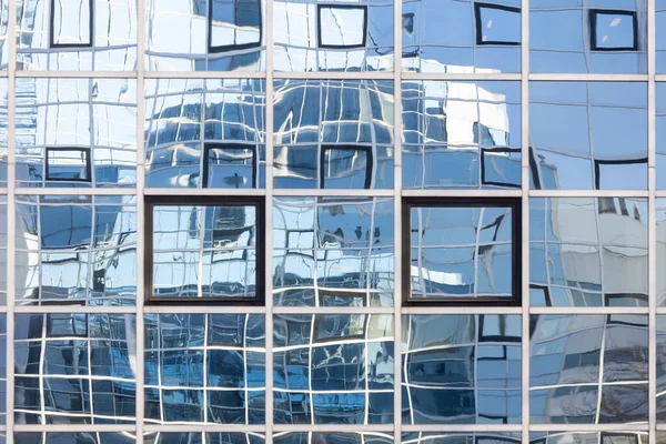 Abstract patterns and reflections in windows of modern office buildings — 스톡 사진