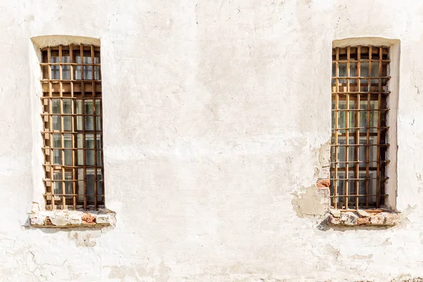 Gated window on the wall of an old building