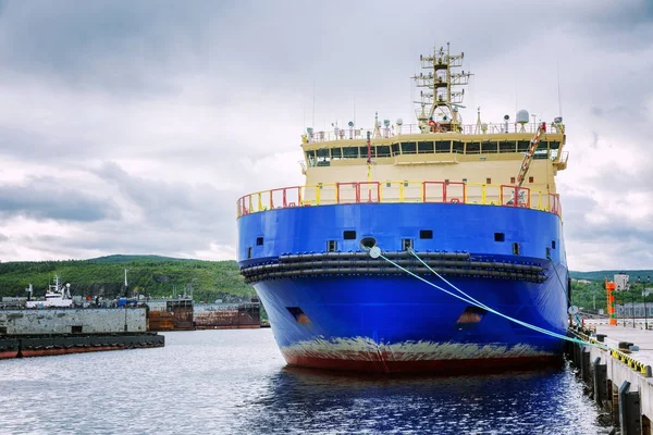 Large beautiful industrial ship on the water at the pier