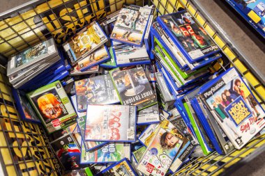Amsterdam, Netherlands, 10/11/2019: Assortment of video games in the store. clipart