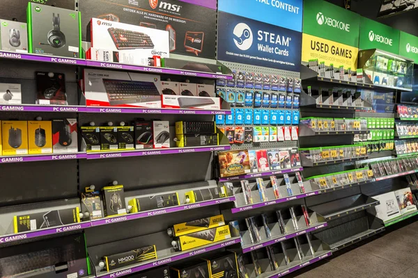 Amsterdam, Netherlands, 10/11/2019: Assortment of video games in the store. — Stock Photo, Image