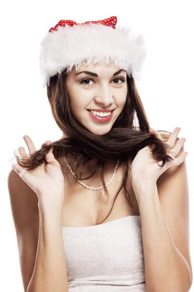 サンタクロースの帽子の美しい若い女性の感情的な肖像画。新年の気分。白地に隔離された. — ストック写真