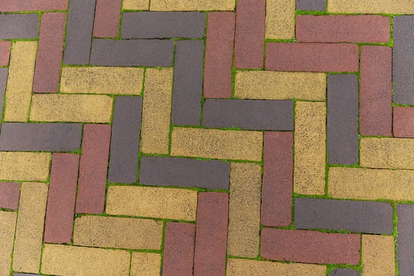 एक ज्यामितीय पैटर्न के साथ बहु रंगीन फ़र्श स्लैब। बैकग्राउंड . — स्टॉक फ़ोटो, इमेज