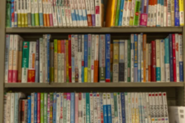 Many Different Books Shelves Store Blurred Background — Stock Photo, Image