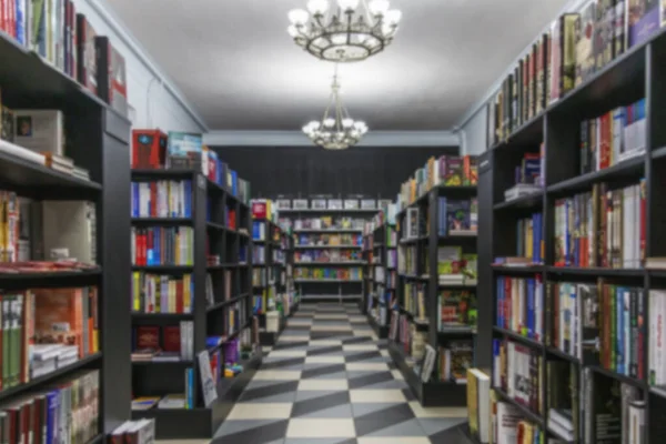 Floor racks with books in a stylish store. Knowledge and education. Blurred.