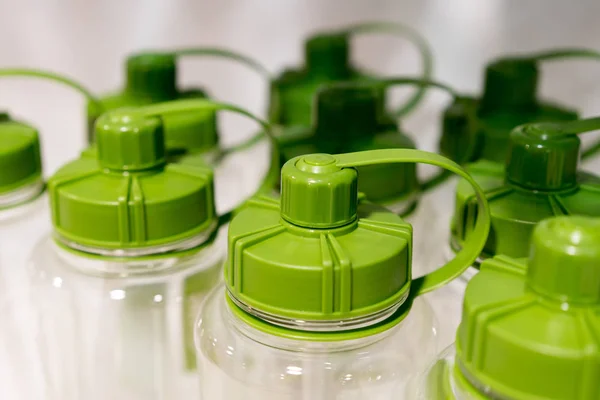 Green sport drink bottles with safety cap — Stock Photo, Image