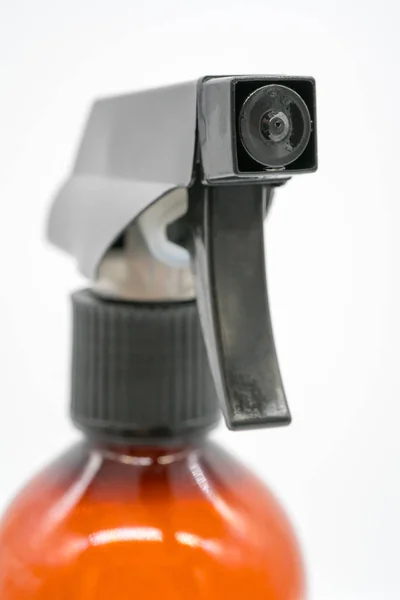 Close up black plastic nozzle of brown transparent spray bottle — Stock Photo, Image