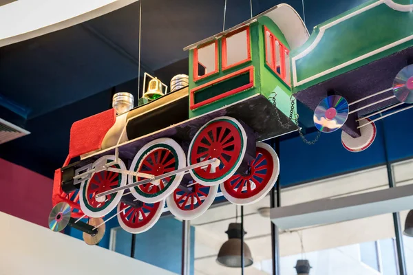 Colorful train toy hanging on the ceiling