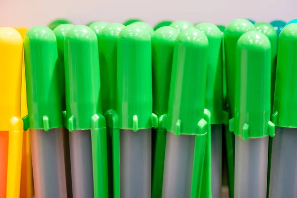 Colorful pen caps on white — Stock Photo, Image