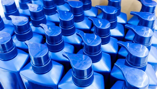 Round blue plastic bottle with dispenser pump for liquid soap, s — Stock Photo, Image