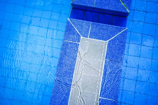 Ceramic tile edge partition within swimming pool — Stock Photo, Image