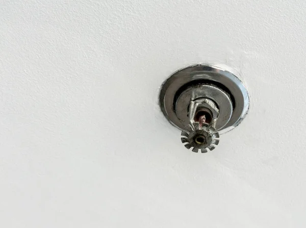 Used fire extinguisher ceiling water sprinkler — Stock Photo, Image