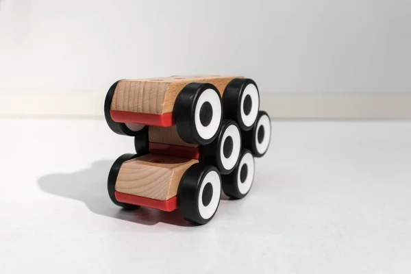 Stack of wooden toy cars with shadow in perspective view.  Six w — Stock Photo, Image