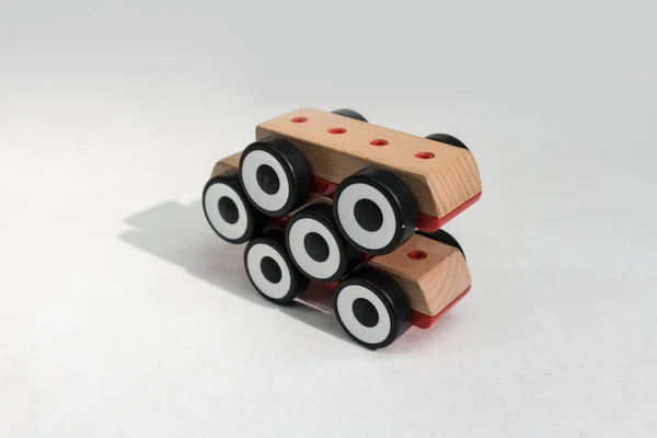 Stack of wooden toy cars with shadow in perspective view.  Six w — Stock Photo, Image