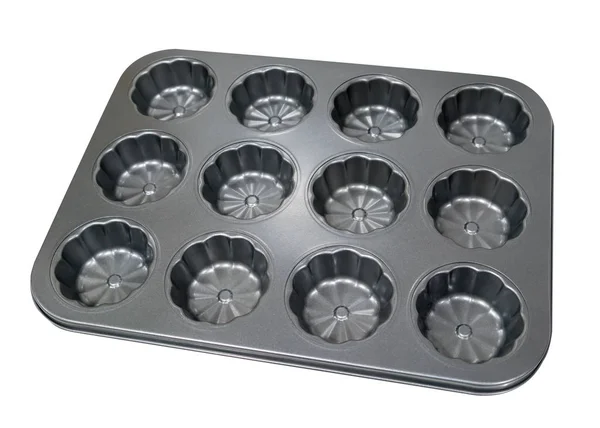 Bandeja de queque de muffin de metal vazio para assar isolado no bac branco — Fotografia de Stock