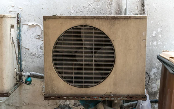 Old vintage rusting metal exterior fitted airconditioning unit m