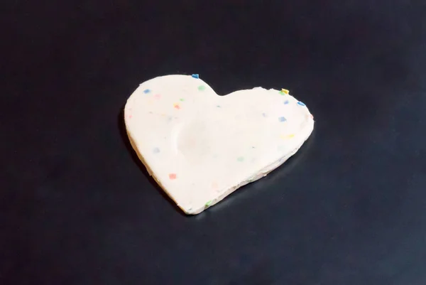 Multi-colors valentine heart made with plasticine on black backg