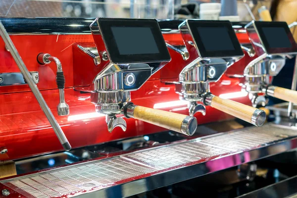 Automatic red coffee machine in coffeeshop or restaurant.