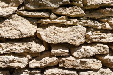 Farklı büyüklükte taş duvar. Arka plan.