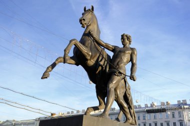 Statue of the conquest of a horse on the Anichkov Bridge in St.Petersburg, Russia. clipart