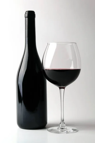 Bottle of red wine with glass — Stock Photo, Image