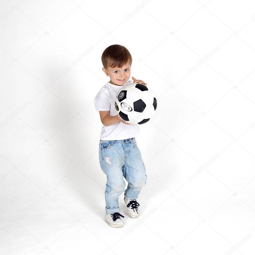 Little boy playing with soccer ball