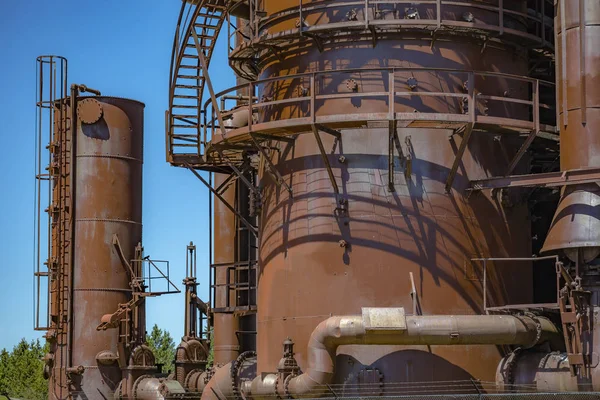 Abandoned old machines and storage units in a gas industry at ga