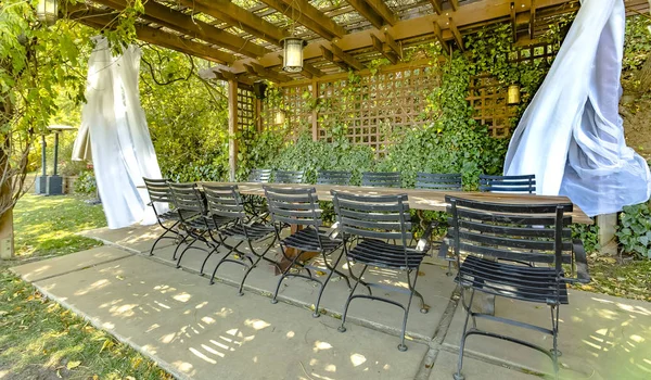 Eating area with some white drapes outside. Setup from a souther — Stock Photo, Image