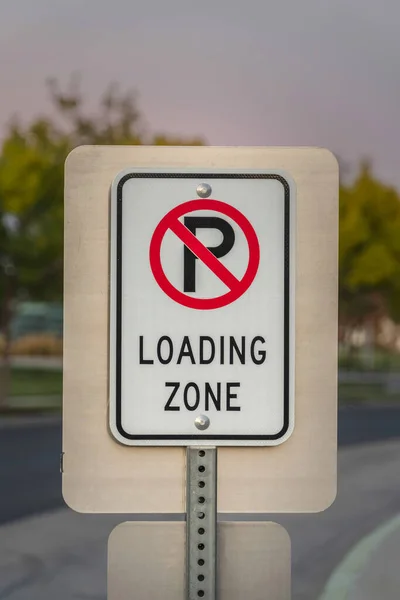 No Parking sign for vehicles for a Loading Zone