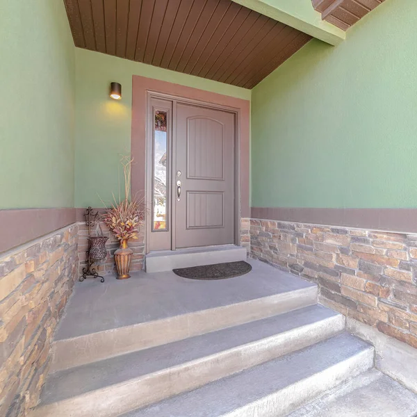 Square frame Front porch and door of traditional green home