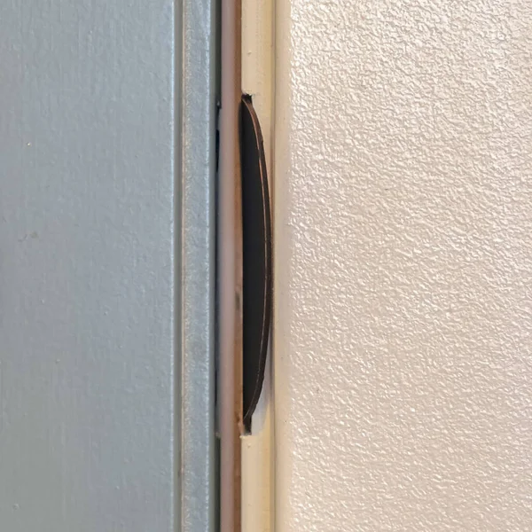Square Close up of unlocked deadbolt latch on home door — Stok fotoğraf