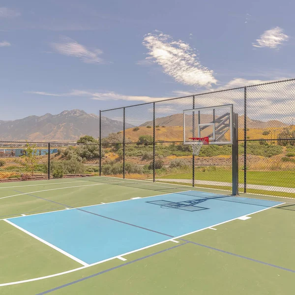 Square frame Outdoor green basketball court three point line