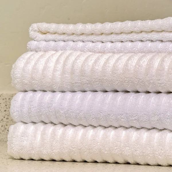 Square Pile of clean absorbent ribbed cotton towels — Stock Photo, Image