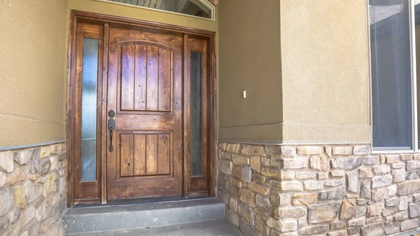 Panorama frame Brown wooden front door of home with sidelights and arched transom window — Stock Photo, Image