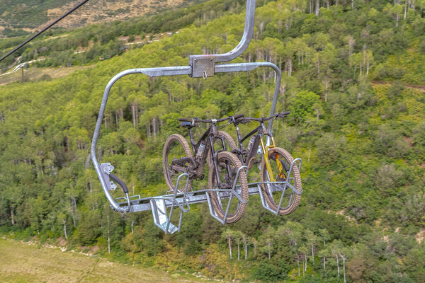 Close up of chairlifts with mountain bikes in Park City ski resort at off season