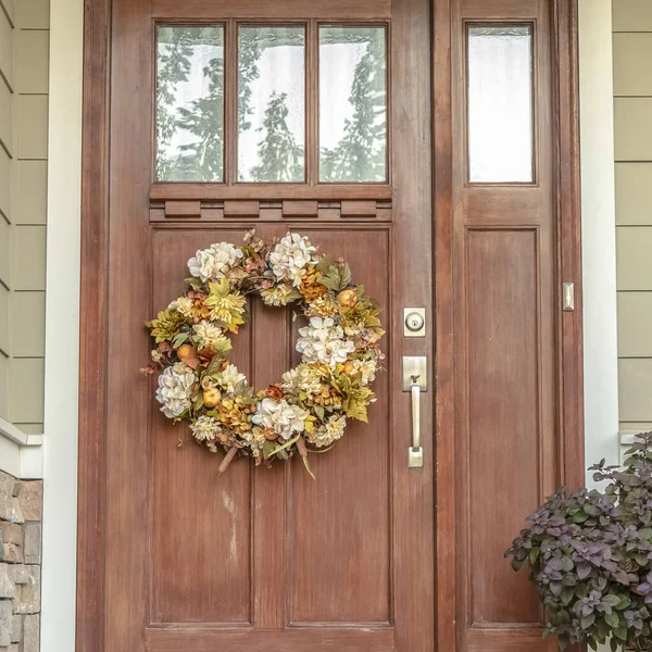 Square frame Front door with dried flower wreath day