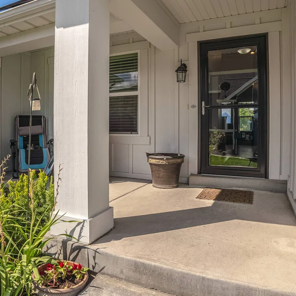 Square frame Covered porch and glass entrance door to a house — Stock Photo, Image