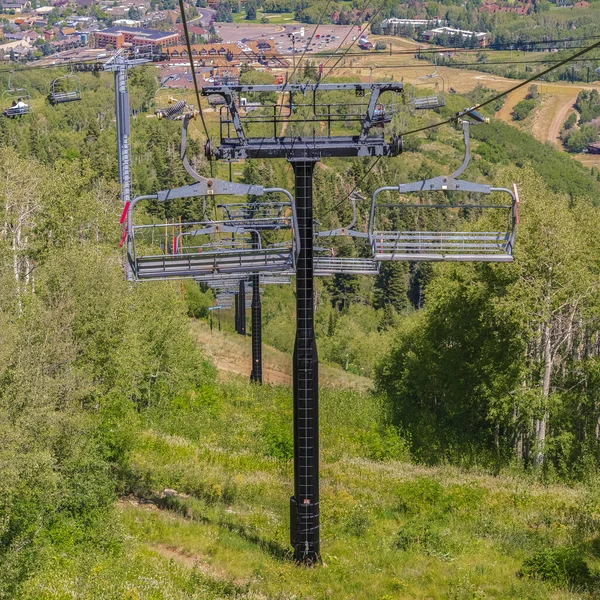 Square Hiking trails and buildings in Park City viewed from chairlifts at off season