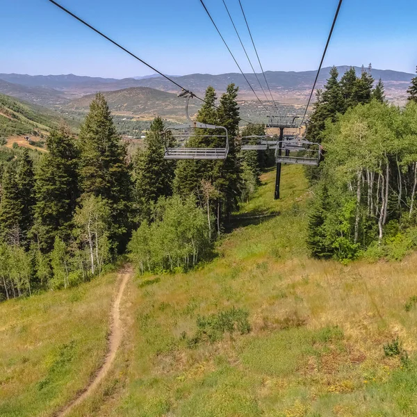 Square Scenic mountain in Park City at off season with highing trails under chairlift — стокове фото