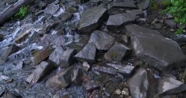 Fast-moving water trailing over a hiking path toward the top of Mount Timpanogos in Utah Valley — Stock Video
