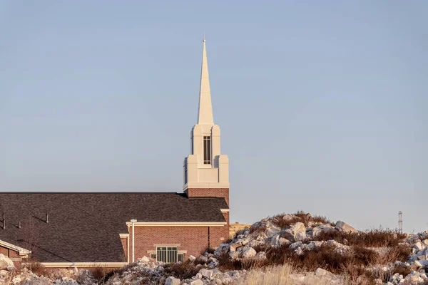 Small modern church with white steeple near sunrise — Stock Photo, Image