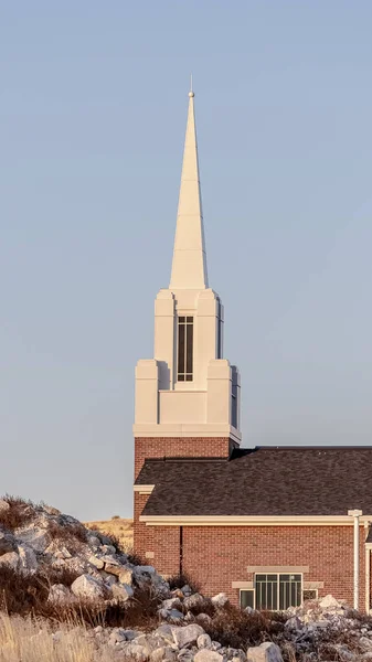 Vertical Small modern church with white steeple near sunrise — Stock Photo, Image