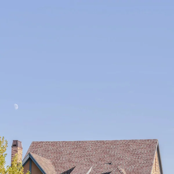 Square frame Steeply pitched house roof with dormer windows — ストック写真