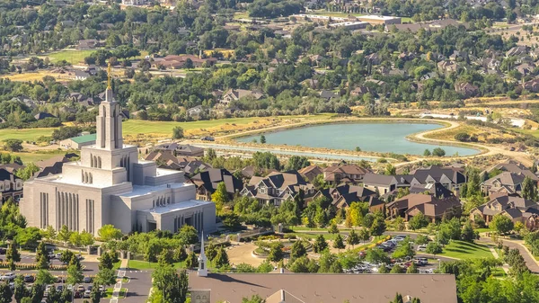 Pano frame Temple and geart shaped lake amid buildings and houses in Salt Lake City Utah