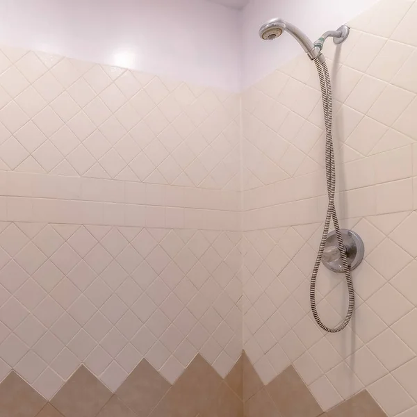 Square Bathroom interior with shower installed on the wall with white and brown tiles — Stock Photo, Image