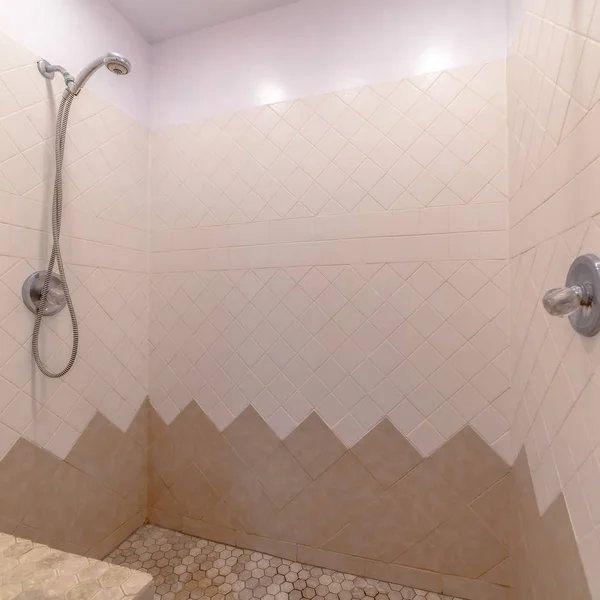 Square frame Bathroom interior with shower installed on the wall with white and brown tiles — 스톡 사진