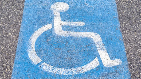 Panorama Disabled or Handicapped road sign on asphalt — Stock Photo, Image